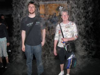 Chris and Mom stand under a curtain of mist...