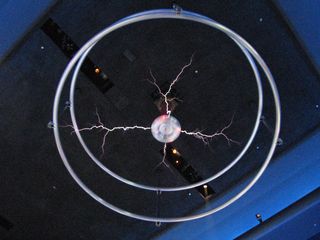 The Tesla coil was by far the coolest (and loudest) thing in the "Science Storms" exhibit. The museum did educational shows from time to time throughout the day, and would activate the Tesla coil as part of the show. It made a loud buzzing sound, and electricity visibly moved between the center and the rings.