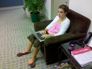 After finding out that Caitlin was leaving Food & Water Watch while I was in Chicago, it soon turned out that due to the hiring of her successor in short order, Caitlin was bumped from her desk! Thus she is sitting here in one of the reception chairs, working on a laptop and making a sad face...