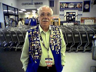 This gentleman is a greeter at the Wal-Mart in Manassas. By the end of the year, he had amassed a collection of more than 400 pins, which he wears on his vest.