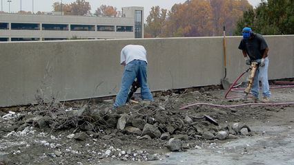 On my November 9 DC trip, I first noticed workers demolishing the sidewalk along the top level of the Vienna Metro station's North Garage. I just love watching these things happen, though I don't like the jackhammer noise.