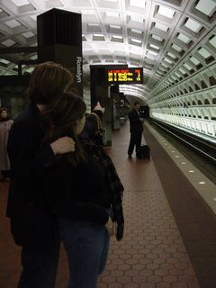 Sis shows Chris the PIDS display on the upper level platform at Rosslyn. We would ultimately ride that six-car Orange Line train to New Carrollton that was to arrive in one minute.