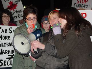 Playing "O Canada" into the bullhorn, on the kazoo.