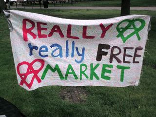 The "Really Really Free Market" was a monthly event put on by an anarchist collective in Dupont Circle during the summer of 2008. The idea was that of a swap meet, where people brought things that they no longer wanted, and took what they wanted, and no money changed hands. All in all, it was a fun event. The first, shown here, took place on May 10.