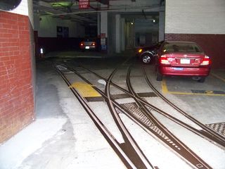 Meanwhile, inside the car barn, which has now been converted for other uses, the old streetcar tracks still exist in the concrete floor!