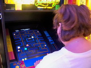 After we finished in the tower, we found a small arcade in the building's ground floor, and Katie got to play her first-ever game of Pac-Man.