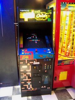 After we finished in the tower, we found a small arcade in the building's ground floor, and Katie got to play her first-ever game of Pac-Man.