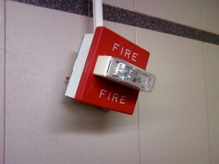 When Mom and I were out and about in Charlottesville, I ran across this - a fire alarm basically dangling from a panduit.