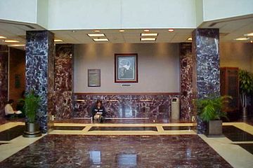 The main lobby spans two stories, and serves as the link between the classroom wing and the office tower.  As built, the lobby made heavy use of marble in its design.  A portrait of Zane Showker, the building's namesake, hung on the back wall.