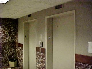 The office tower elevators, unlike the classroom wing elevator, had received updates.  The marble, seen in the view from 2000 (left), is all gone, replaced with drywall, the floors were changed from marble to tile, and the elevator doors were changed from white to stainless steel.