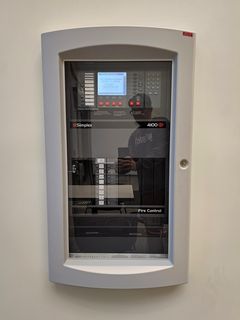 The fire alarm system in Zane Showker Hall following renovations is a Simplex 4100 voice evacuation system, which is similar to what the university has been installing in all of their buildings as of late.