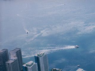 Three shots from the CN Tower's upper viewing deck.