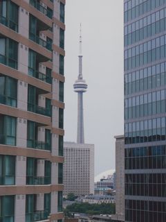 The CN Tower, at left seen from Sarah's room at the Delta Chelsea, and at right, almost directly beneath it.