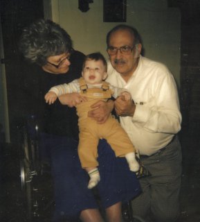 My grandparents on my father's side, Ruth and Seymour ("Pop") Schumin, with me as a baby.