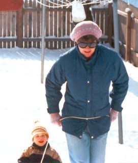 When the snow fell, Mom used to run me around the background on our little orange sled. That sled was awesome, and we used it until it literally fell apart in 1991.