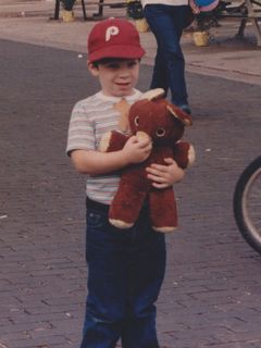 At the Teddy Bear Parade in Rogers, Arkansas in 1985 or 1986, I brought my bear, Chris. Unfortunately, however, Chris the bear later managed to escape my sight and got sold at a yard sale.