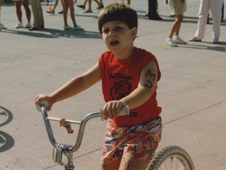 In the "Trianimal Triathlon" in summer 1987. The Trianimal Triathlon was a team-based event, with running, swimming, and bicycling. I was the bicycling part of the team, seen here ahead of my part of the event.