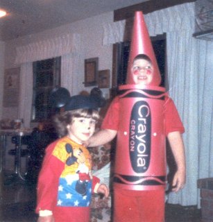 I went as a crayon for Halloween in 1987, and Sis went as Mickey Mouse. And by the looks of it, I've found something far more interesting to look at than the camera.