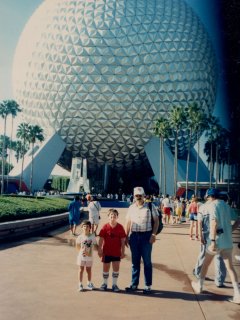 From left to right, Sis, me, and Dad, standing in front of Spaceship Earth at EPCOT Center.