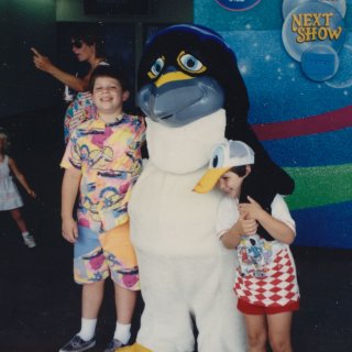Sis and I pose with a giant penguin.