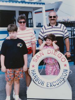 On our last morning in San Diego, we went on a short cruise around the harbor. I remember that I was unhappy that day, but I don't remember why I was so unhappy. My my being mad at something shows in this photo, with three smiling faces... and my stormy expression.