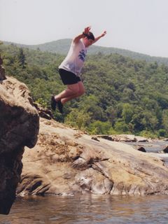 On a church tubing trip on the James River around 1998, I am shown here jumping off a rock into the water.