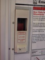 Emergency door release: The emergency door release, like all car types other than the 1000-Series, is flush with the wall. On the 5000-Series, the cover is white, and has a larger window than any other car type.