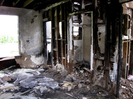 Interior of one guest room, showing extensive fire damage.