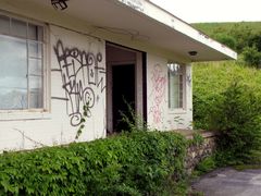 Guest building covered in graffiti.