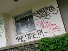 Guest building covered in graffiti.
