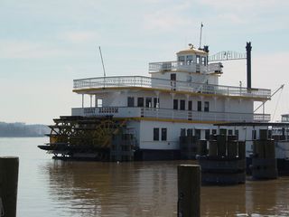 Along the waterfront, there are also a number of boats for quick pleasure cruises. This boat is called the Cherry Blossom.