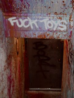 The building's paint-spattered east stairs had "BORF" written at the bottom, and a message written overhead.