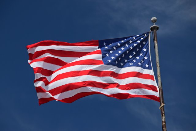 American flag flying above the American Theater.