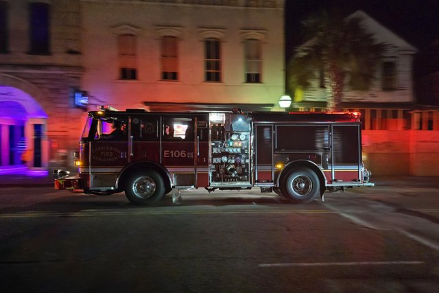 A fire truck travels southbound on King Street.