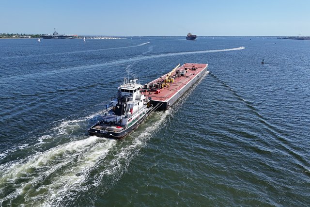 The tug Miss Bettye pushes barge 18701 down the Cooper River.