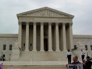 At the foot of the halls of justice, the people make their voices heard.