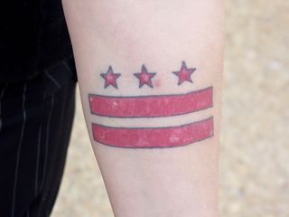 One woman showed off a tattoo of the District of Columbia flag, which she had done after being arrested at a DC statehood rally.