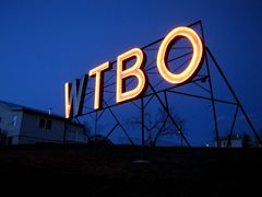 WTBO sign, fully lit at night.