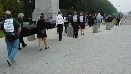 Marchers begin the walk to the White House along the sidewalk, headed into Washington.