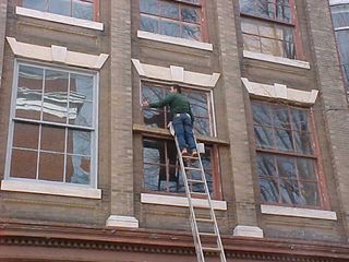 Seems that maintenance work is going on at The Hardware Store... Seems they're repainting window frames. The new color definitely works!