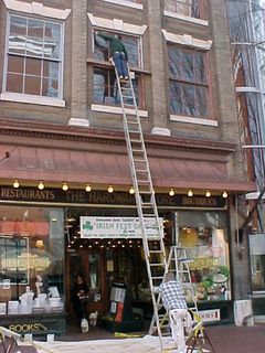 Seems that maintenance work is going on at The Hardware Store... Seems they're repainting window frames. The new color definitely works!