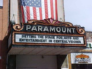 The Paramount Theater is not open currently, though judging from the marquee, it sounds like they want to open it eventually. In the meantime, though, it provides a semi-protected area for vendors. Beautiful sign, though.