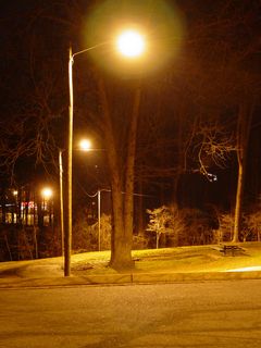 Meanwhile, the parking lot's security lighting, illuminating everything around it, and providing contrast to the darkened sports facilities nearby, gives a glow as if to say, "No matter what else happens in the world, it's going to be all right."