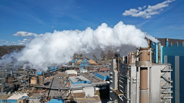 Steam emits from smokestacks at the WestRock paper mill in Covington, Virginia.