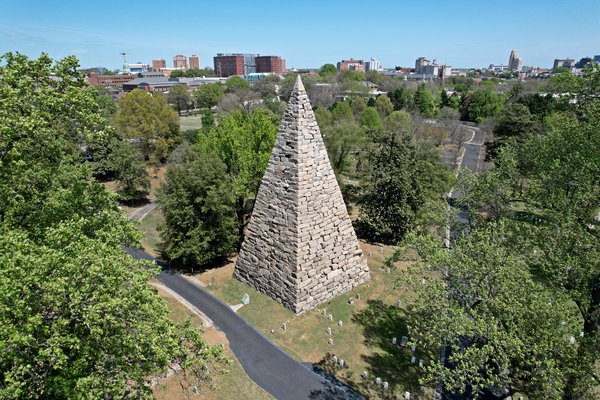 The Monument of Confederate War Dead at Hollywood Cemetery in Richmond, Virginia.  The skyline is visible in the distance.