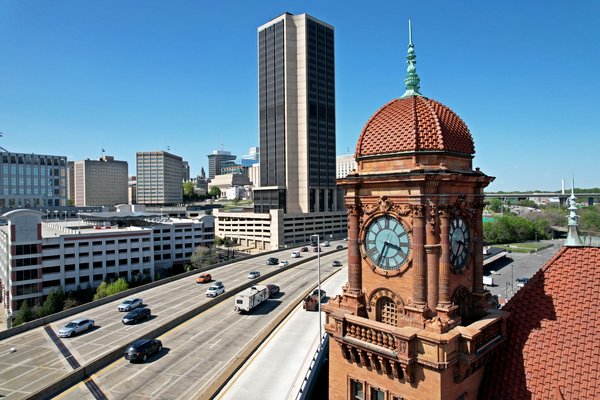 Clock tower on Richmond Main Street Station in downtown Richmond, Virginia, overlooking a large elevated section of Interstate 95.  View facing north.
