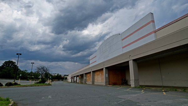 Storm clouds gather above the former Big Kmart store in Charlottesville, Virginia.