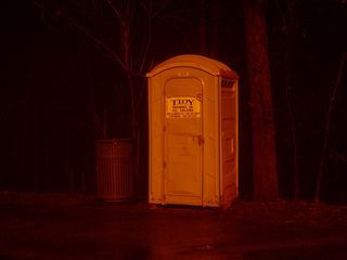 Adjacent to the parking area, a portable toilet exists for the convenience of park visitors. During the day, a "Discovery Center" building is open that contains restrooms, but that facility is closed at night.