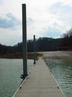 The dock is nothing fancy, but designed to be always available regardless of the water level, as it's designed to be flexible via hinges to ride any waves, and also to rise and fall with changing lake levels, as there are rollers on the points where it connects to the poles.