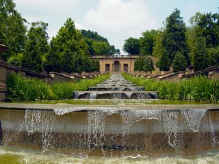 From the bottom of the fountain, the full majesty of its design can be seen, as water falls twice as far to the bottom pool.